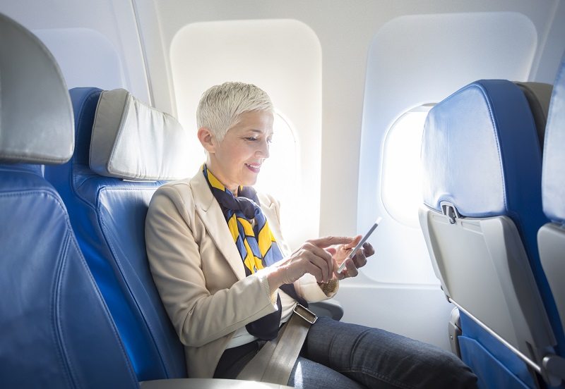 woman long plane flight sitting legs
