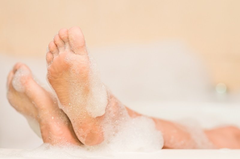 warm bubble bath feet legs 