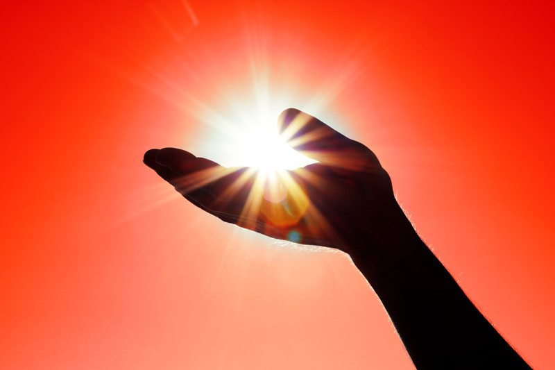 Hand Catching Sun's Ray