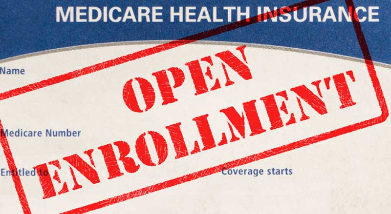 A Medicare card with “Open Enrollment” stamped on it