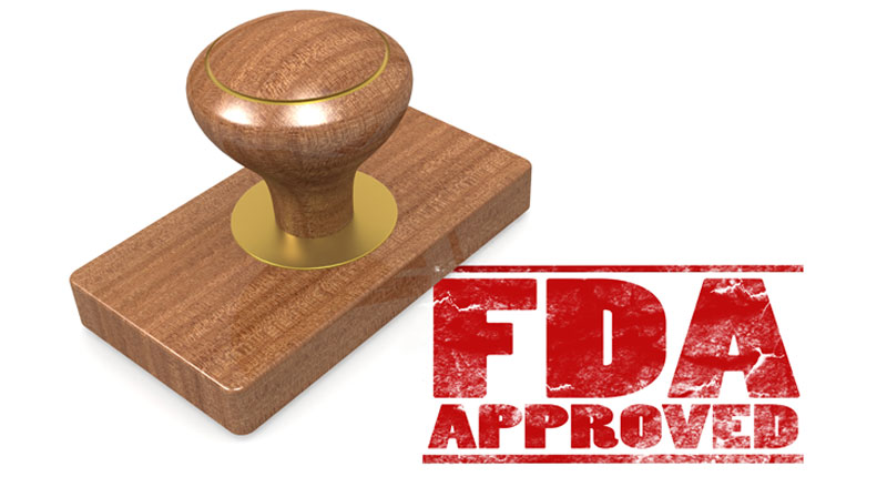 An ink stamp that reads FDA Approved
