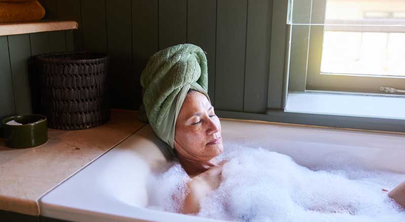 A woman relaxing in a nice bubble bath